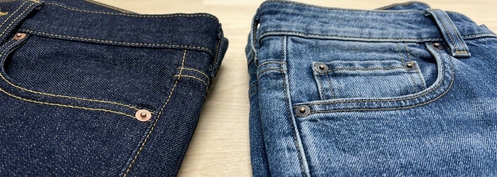 Close-up of trouser waistband, coin pocket, rivets and topstitching