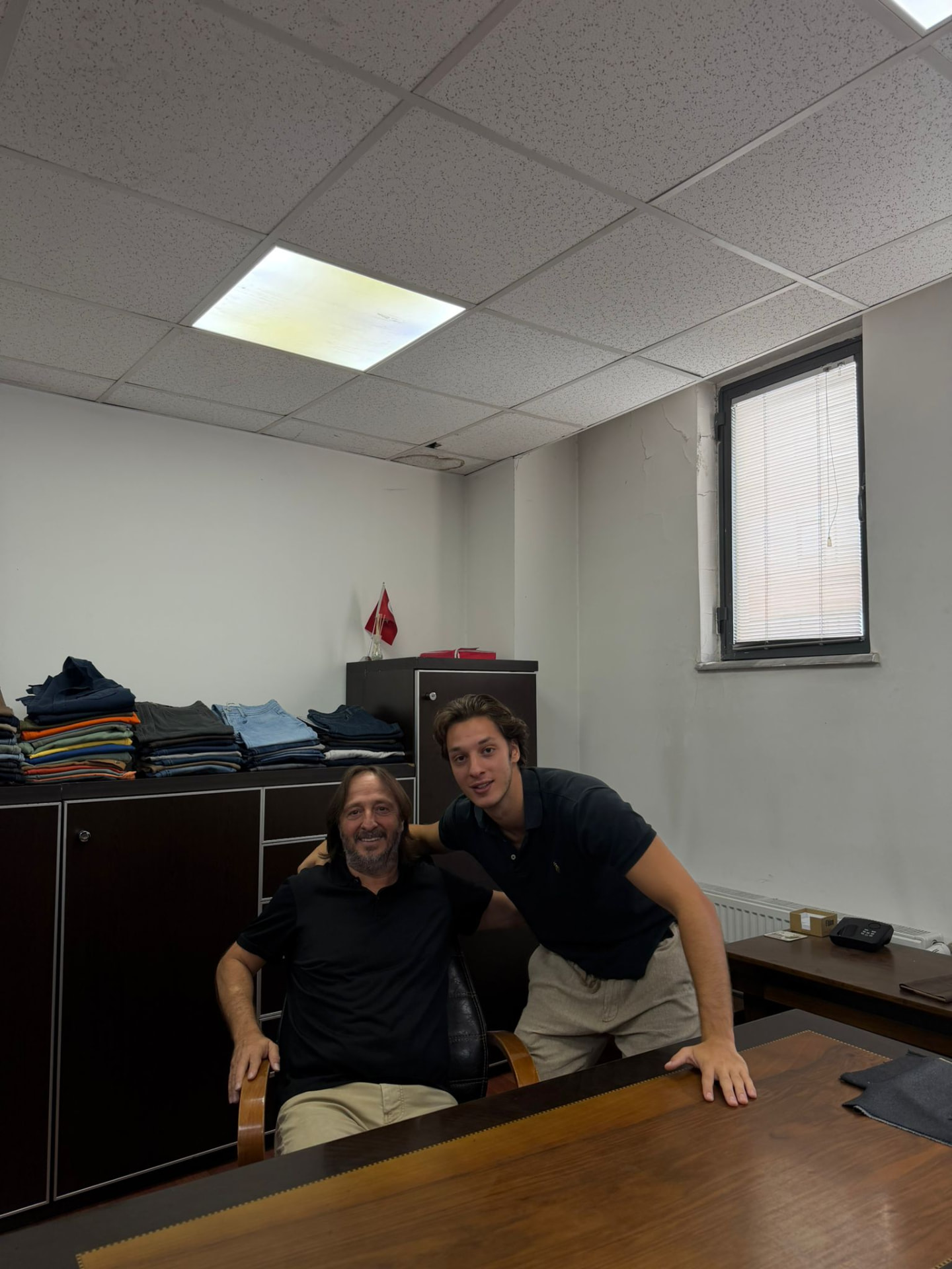 ENTEKS management in the Istanbul sample office, with trouser samples behind